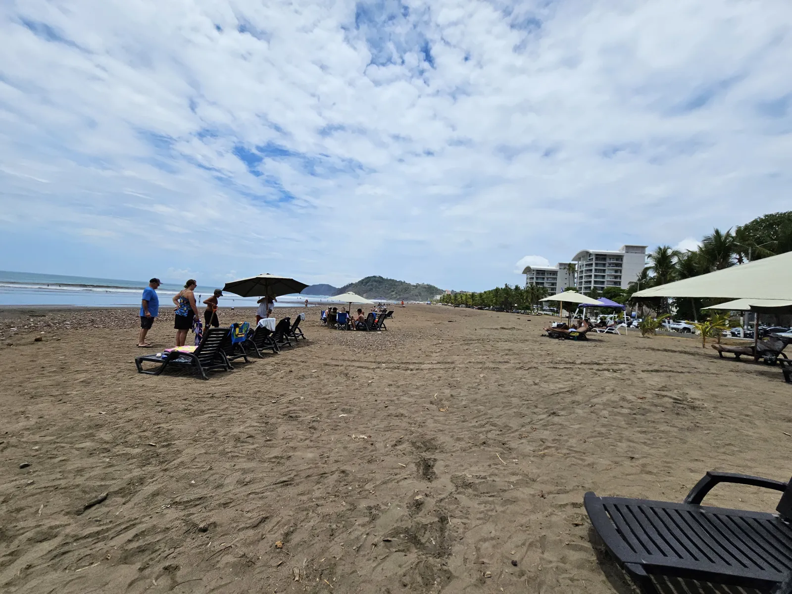 Beach chairs and umbrellas on Jacó Beach